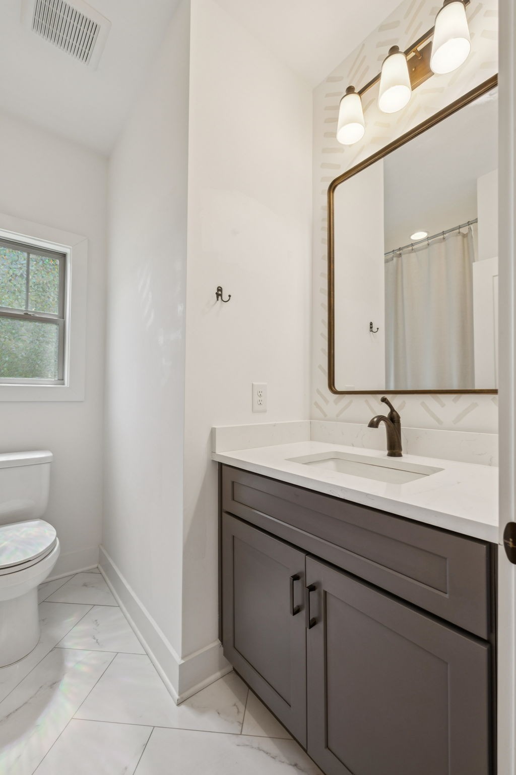 760 Johnson Hollow Road Watertown, TN 37184 - Photo 25 of 53 a bathroom with a sink a toilet and a mirror