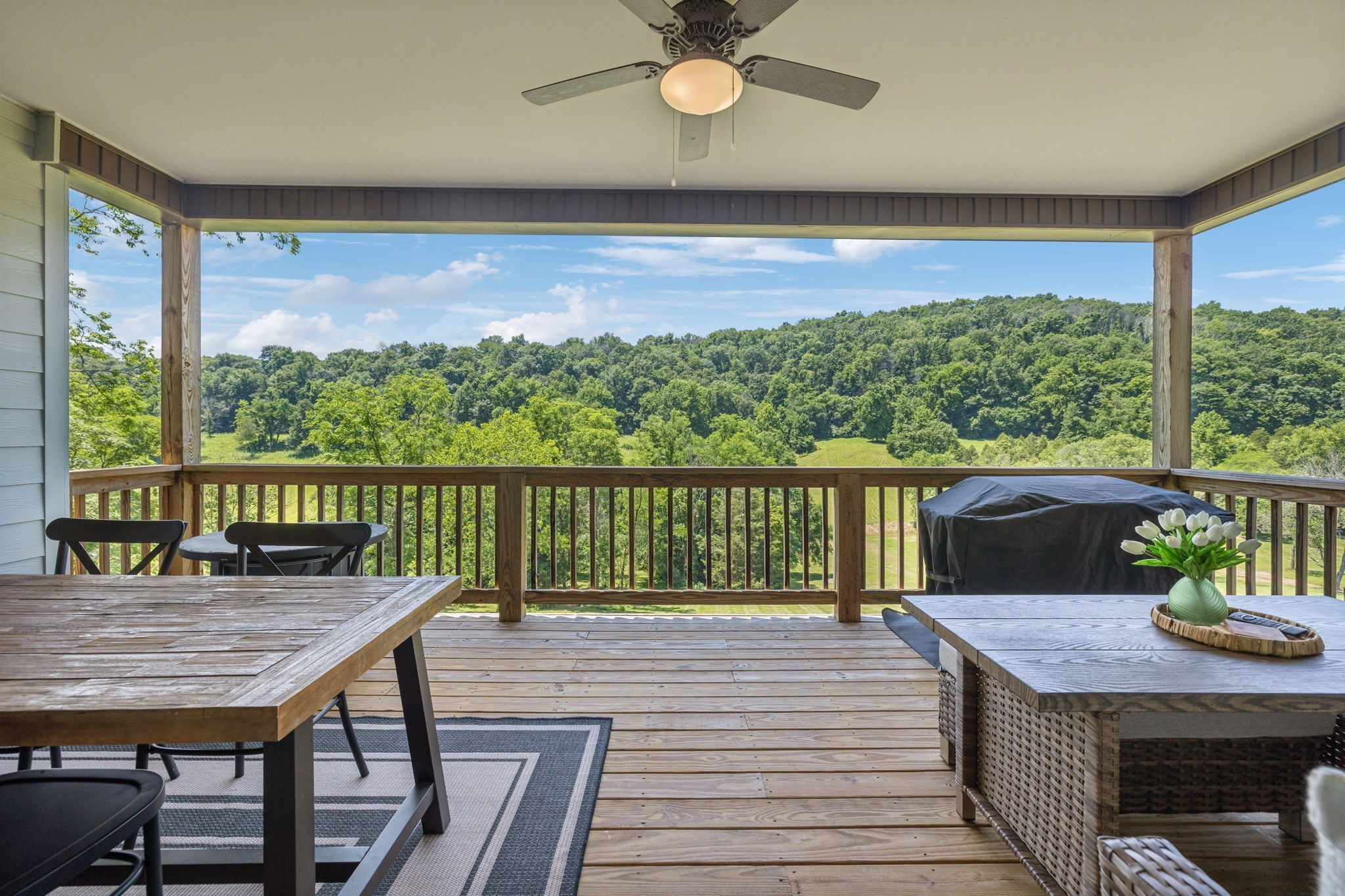 760 Johnson Hollow Road Watertown, TN 37184 - Photo 3 of 53 a view of a balcony with a table and chairs