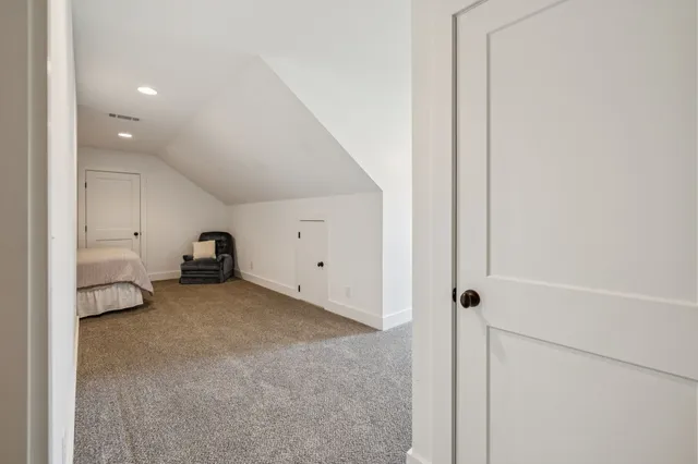 a bedroom with a bed chair and couch