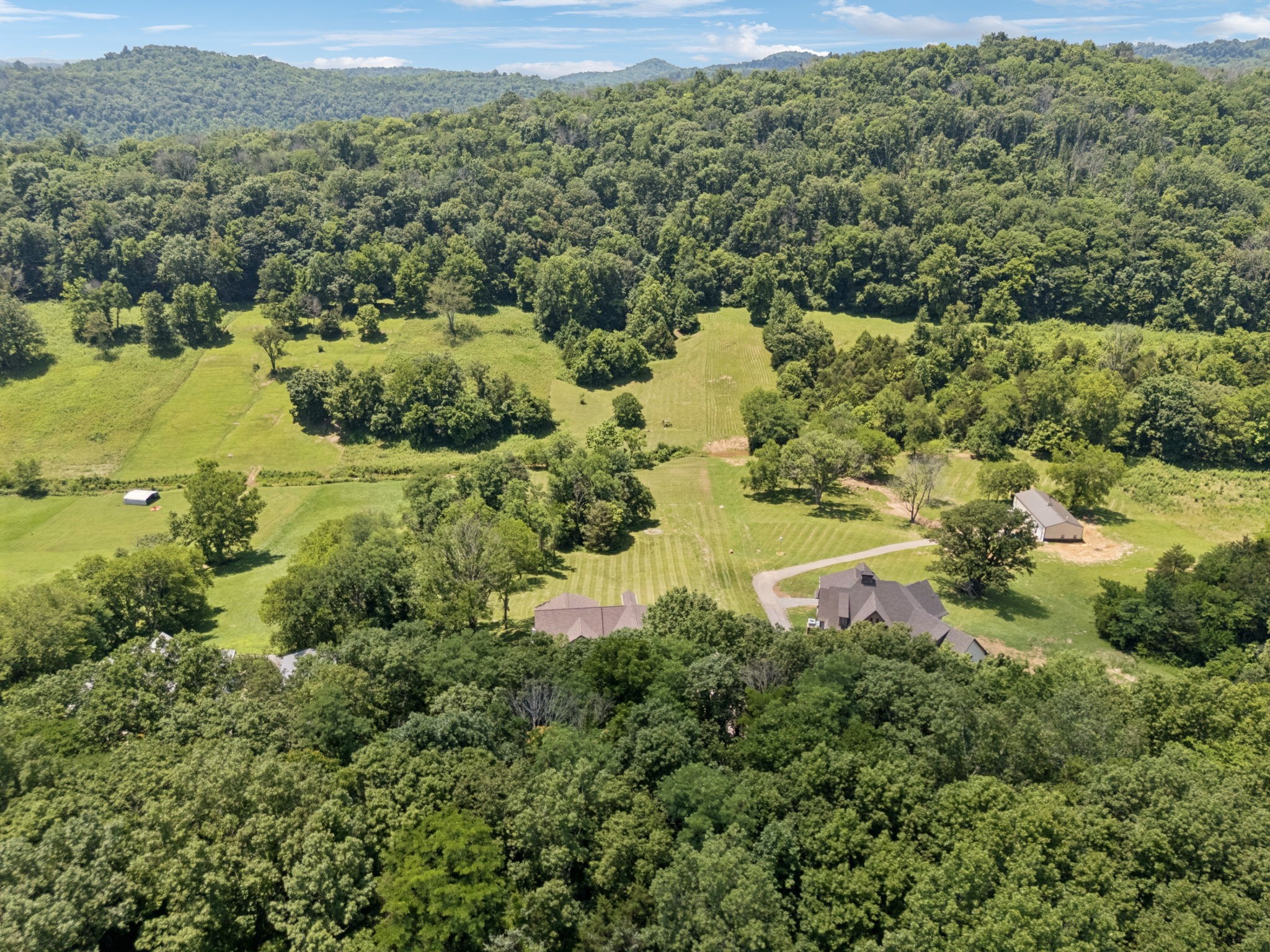 760 Johnson Hollow Road Watertown, TN 37184 - Photo 41 of 53 a view of a lush green forest with houses and lake view