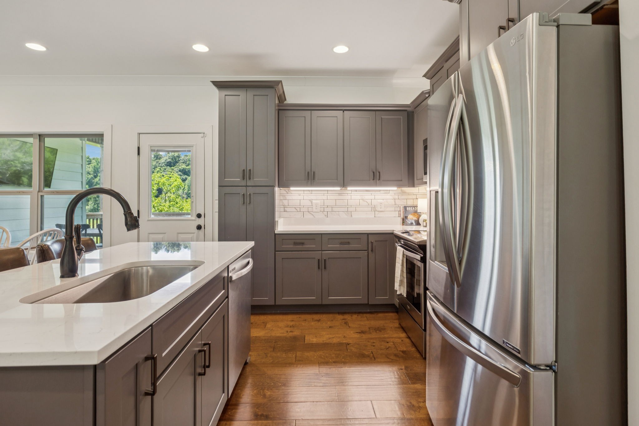760 Johnson Hollow Road Watertown, TN 37184 - Photo 9 of 53 a kitchen with stainless steel appliances granite countertop a refrigerator and a sink