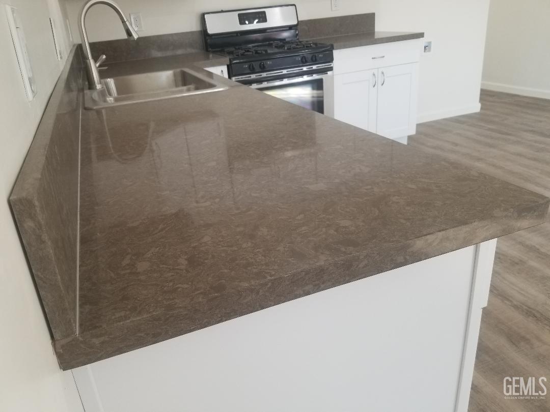 Undisclosed Address Delano, CA 93215 - Photo 4 of 10 a view of kitchen and microwave