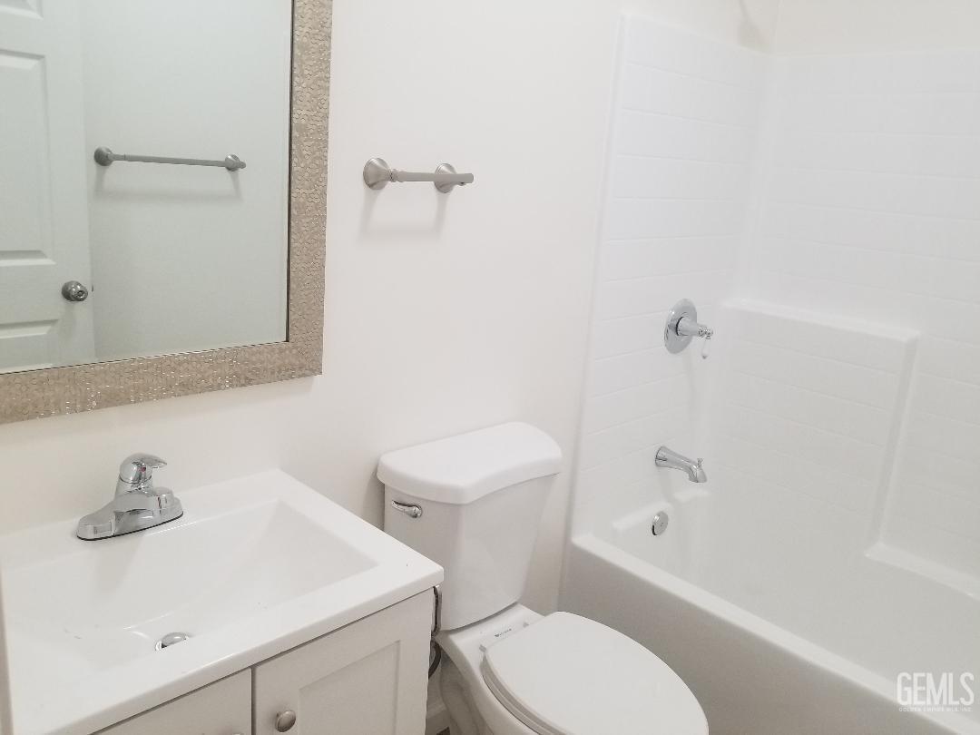 Undisclosed Address Delano, CA 93215 - Photo 9 of 10 a bathroom with a sink a toilet and shower