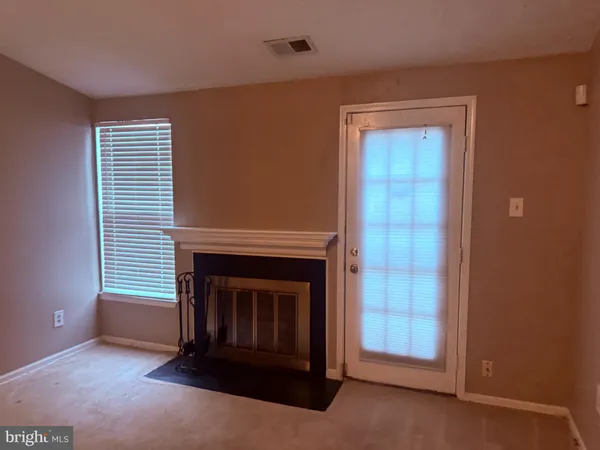 a living room with a fireplace