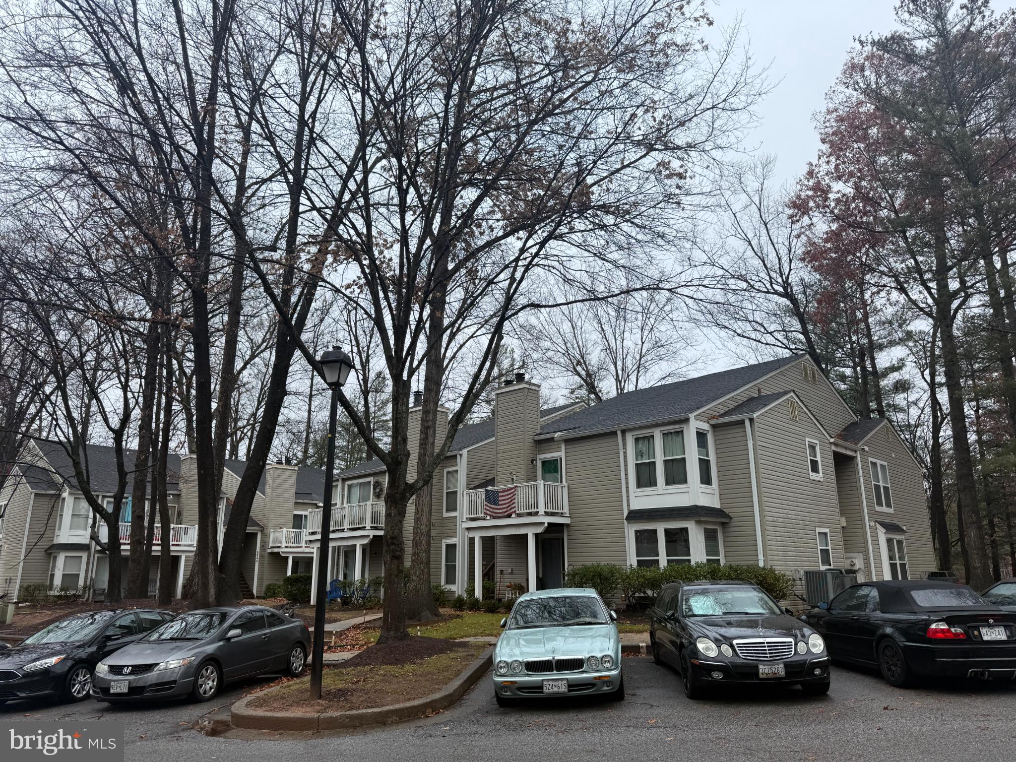 5930 Watch Chain Way, Unit 806 Columbia, MD 21044 - Photo 2 of 26 a car parked in front of a houses