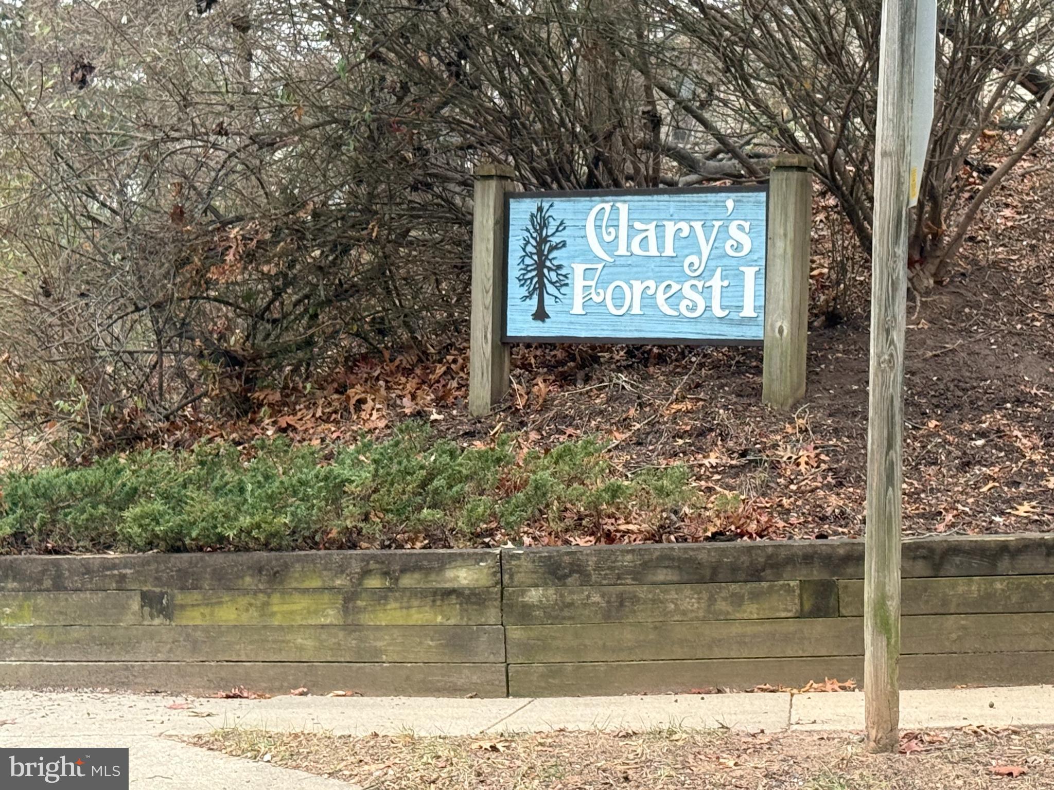 5930 Watch Chain Way, Unit 806 Columbia, MD 21044 - Photo 24 of 26 a sign on the side of a lake