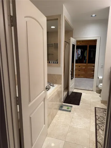 a bathroom with a sink toilet and a mirror