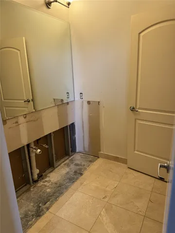 a view of a chair and table in the balcony