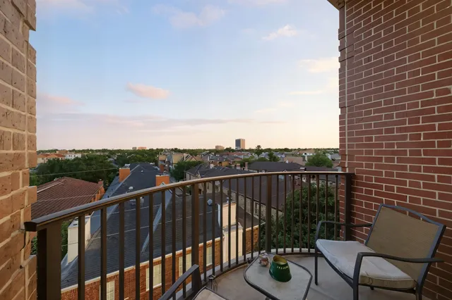 a view of balcony with furniture