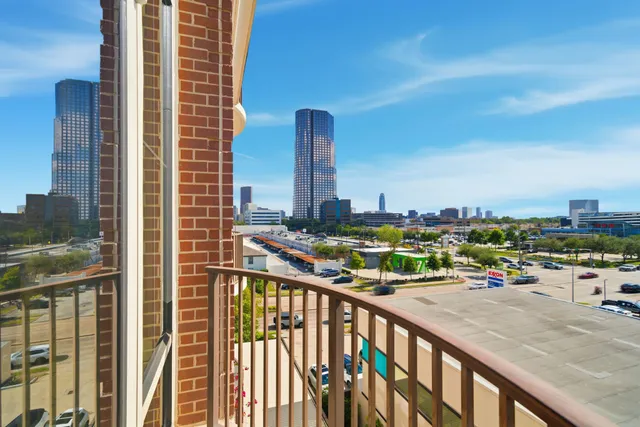 a view of a balcony with wooden floor
