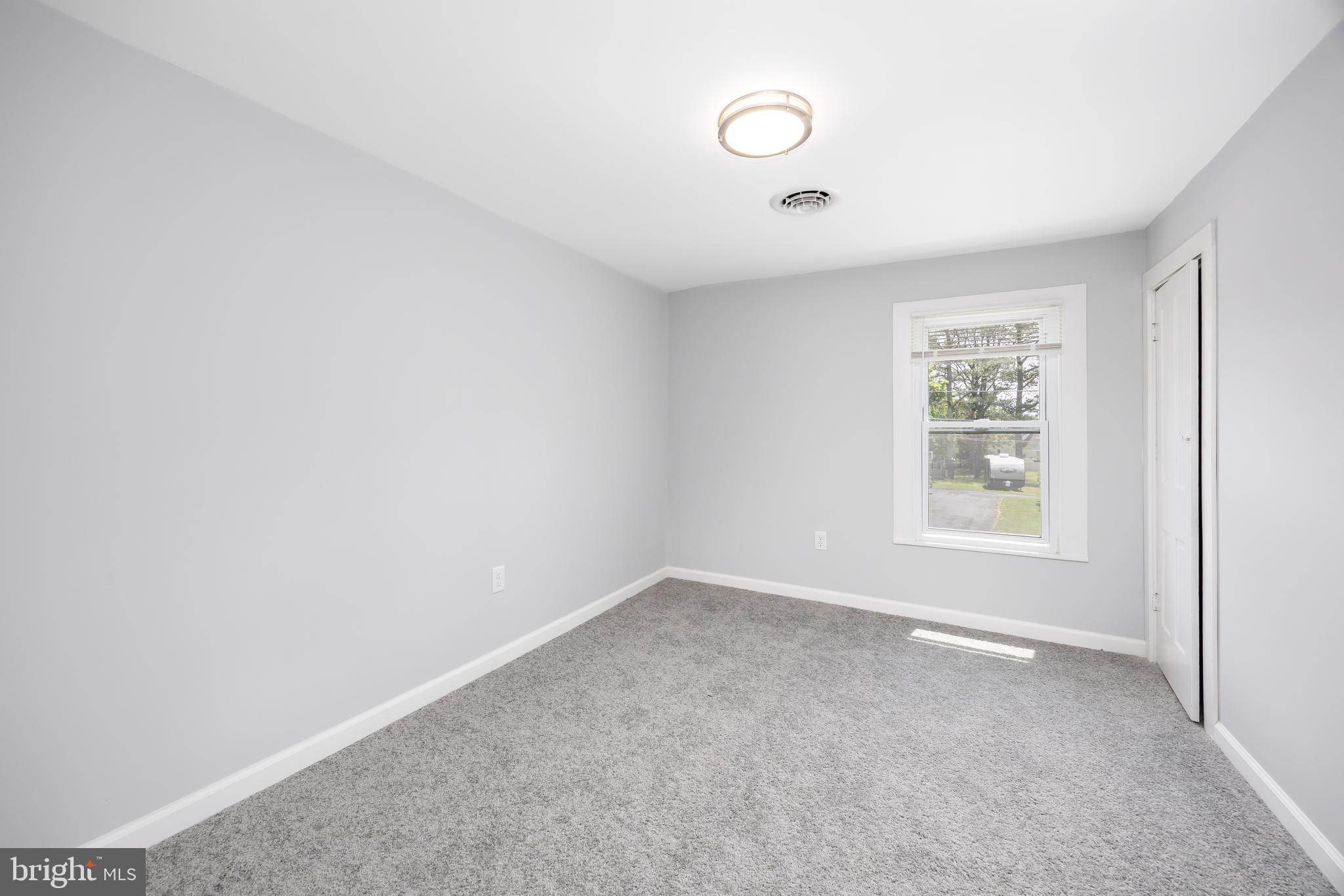 8359 Newark Road Newark, MD 21841 - Photo 31 of 53 an empty room with windows