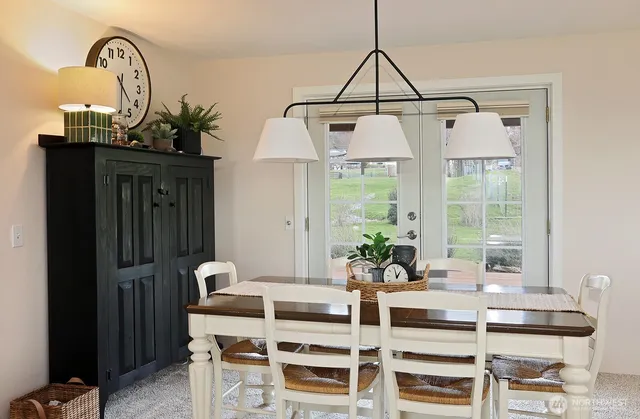 a dining room with furniture and window