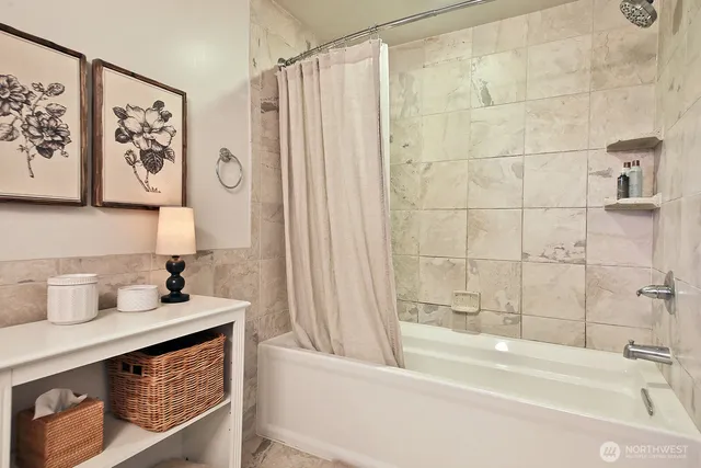 a bathroom with a bathtub and a sink