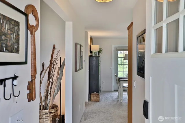 a view of a walk in closet and living room