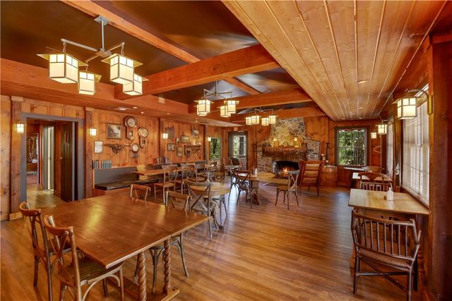 a bath room with a toilet and a bath tub