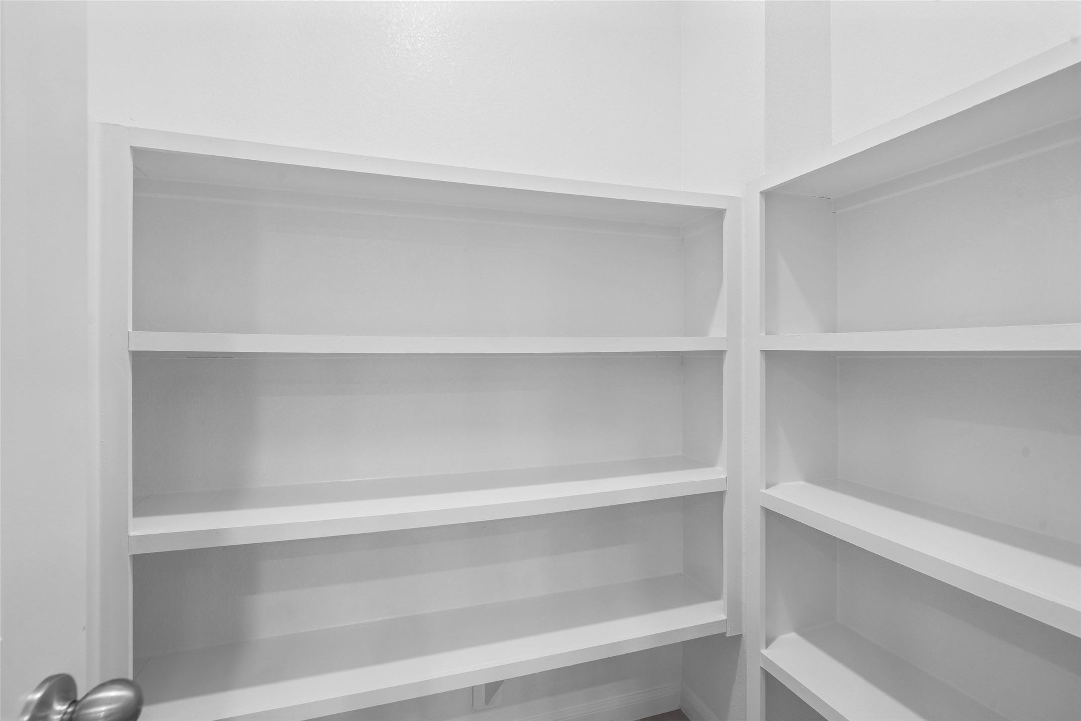 19555 Montgomery Rdg Way Montgomery, TX 77316 - Photo 18 of 38 The walk in pantry is well equipped with wooden shelving, keeping every jar and ingredient organized and within easy reach.