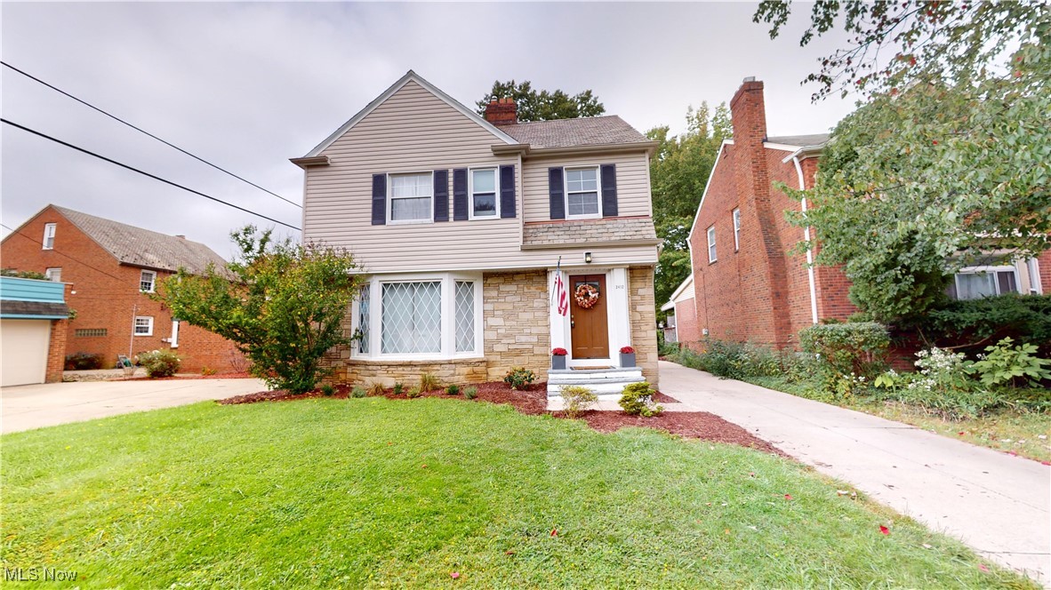 2412 Charney Road Cleveland, OH 44118 - Photo 1 of 48 Front facade with a front lawn