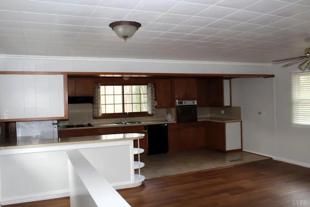 a kitchen with a sink and a stove top oven