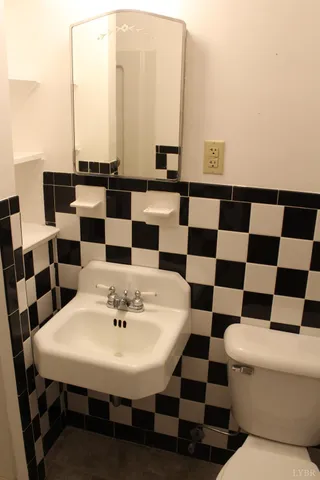 a view of a dining room with a table and chairs