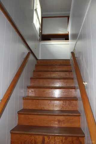 a view of a porch with a table and chairs