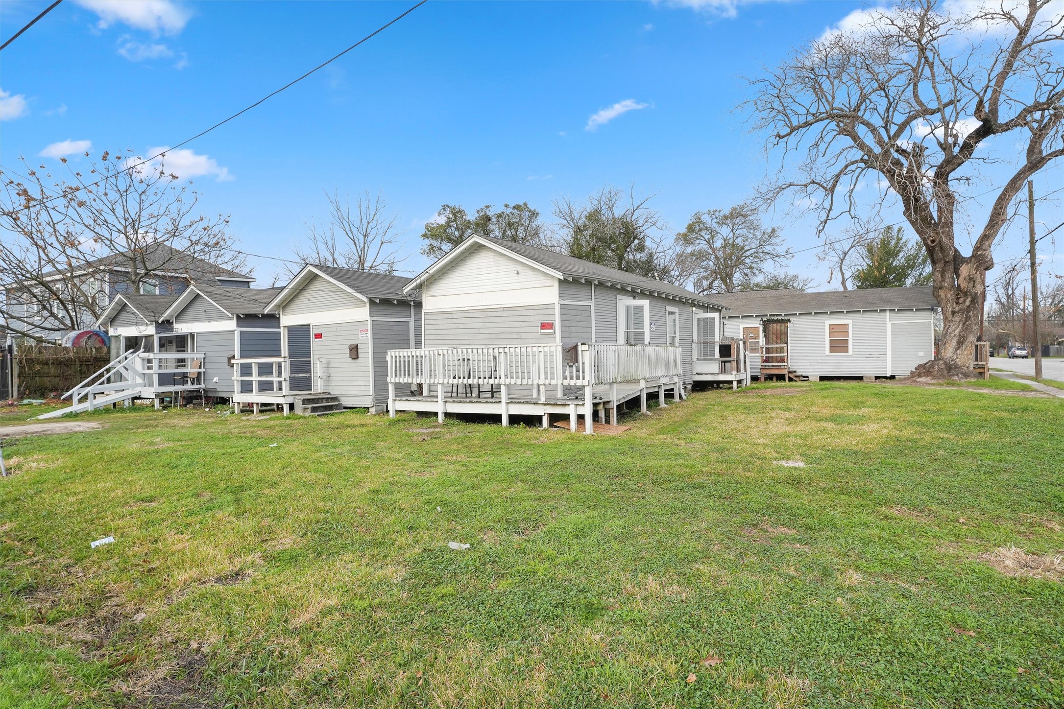 3706 Delano Street Houston, TX 77004 - Photo 13 of 21 a view of a house with a big yard and large trees