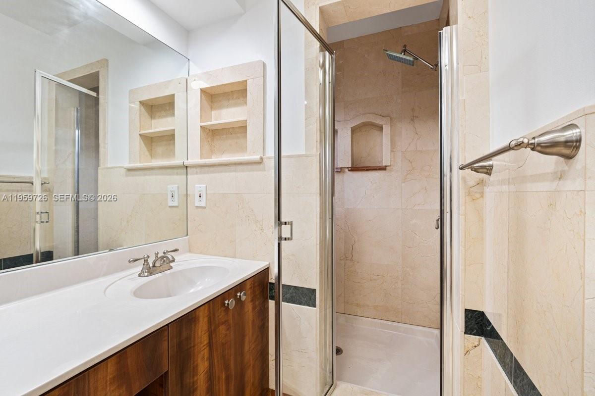 4978 Southwest 35th Terrace Hollywood, FL 33312 - Photo 24 of 24 a bathroom with a double vanity sink and mirror