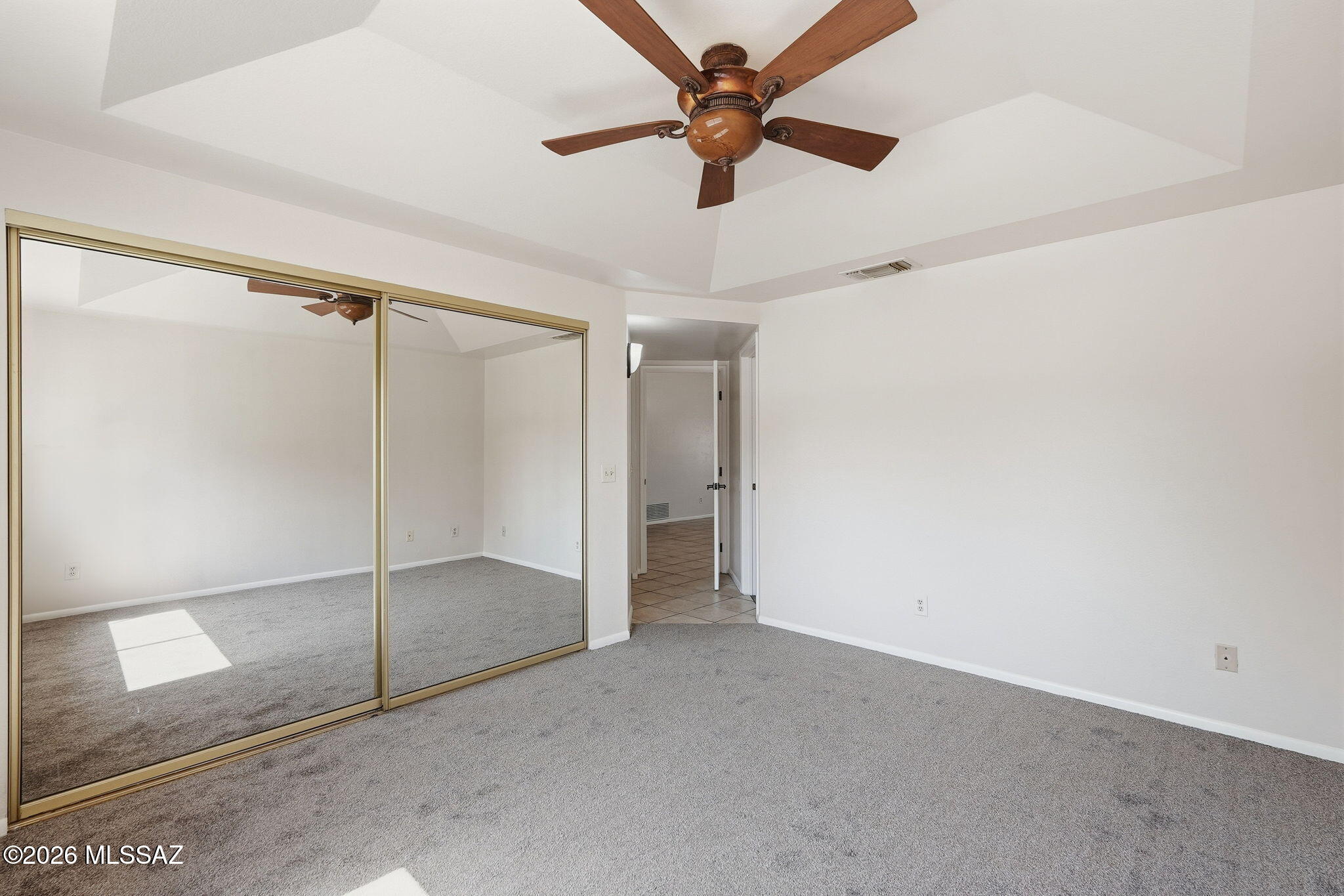5791 North Moonbrook Road Tucson, AZ 85741 - Photo 19 of 40 Primary Bedroom with Double Closets & Fan