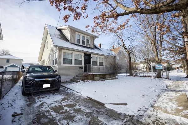 a car parked in front of a house