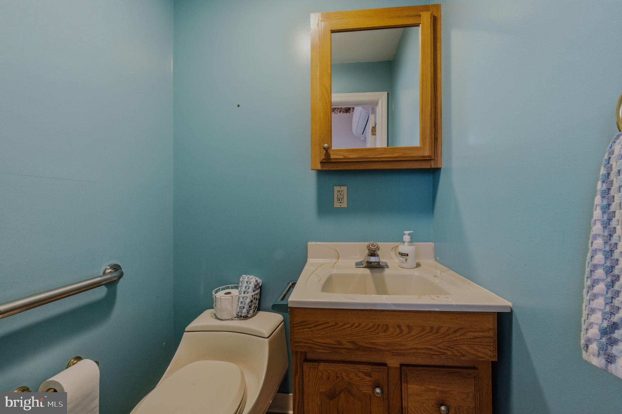 1905 North Scott Street Wilmington, DE 19806 - Photo 12 of 29 a bathroom with a sink toilet and vanity