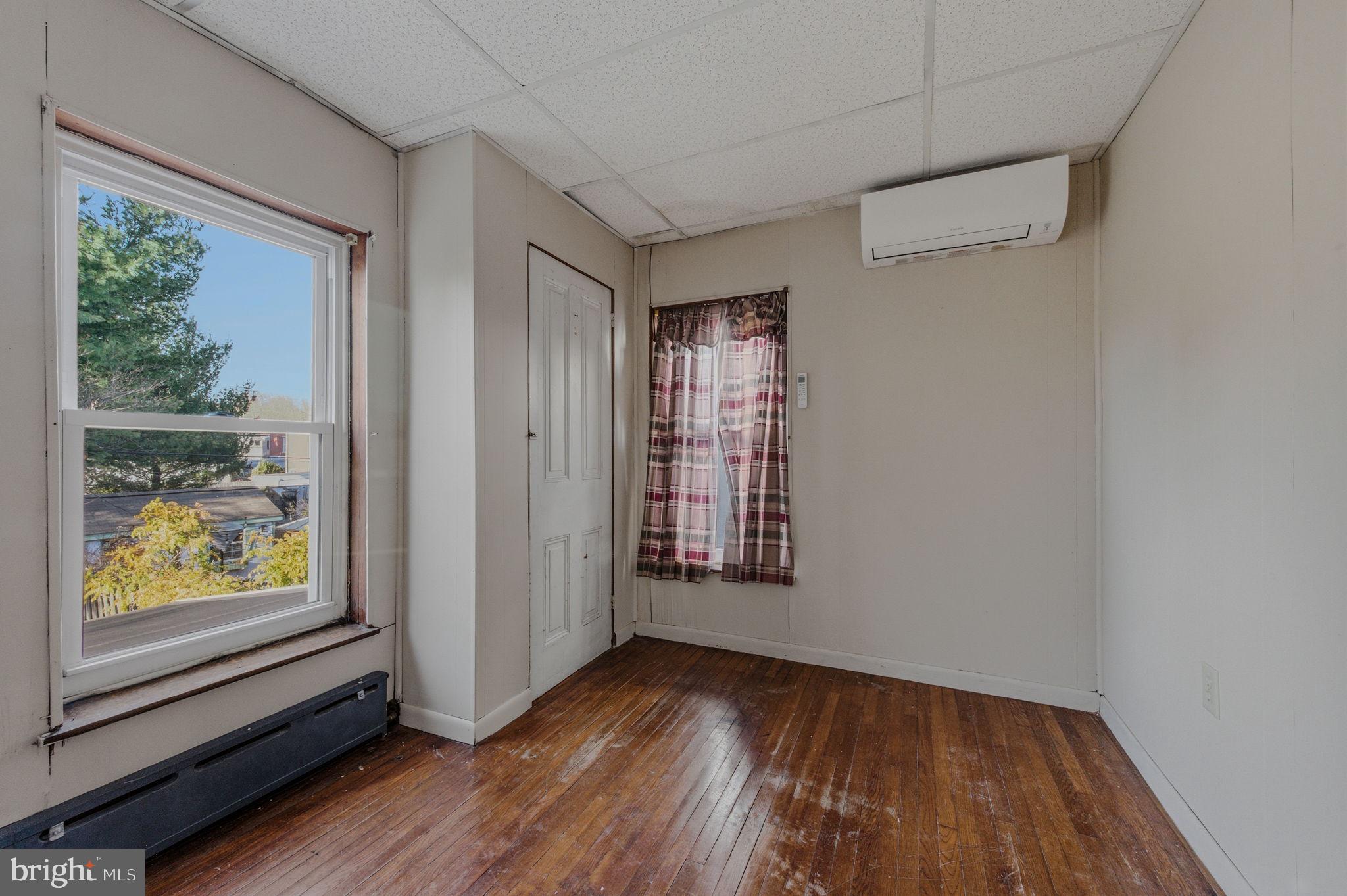 1905 North Scott Street Wilmington, DE 19806 - Photo 15 of 29 a view of an empty room with wooden floor and a window