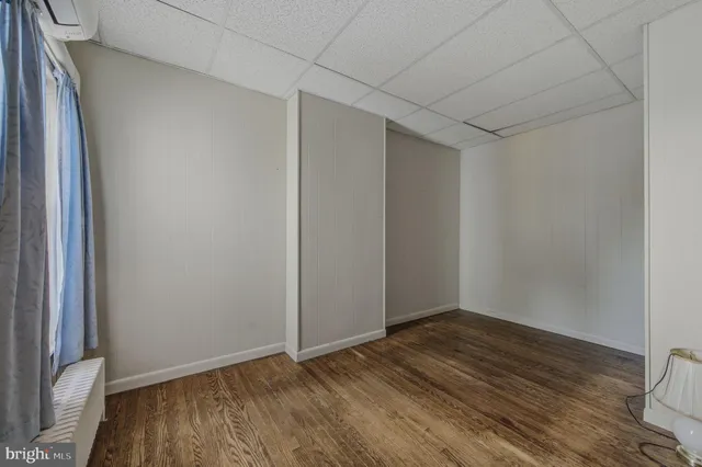 a view of hallway with wooden floor