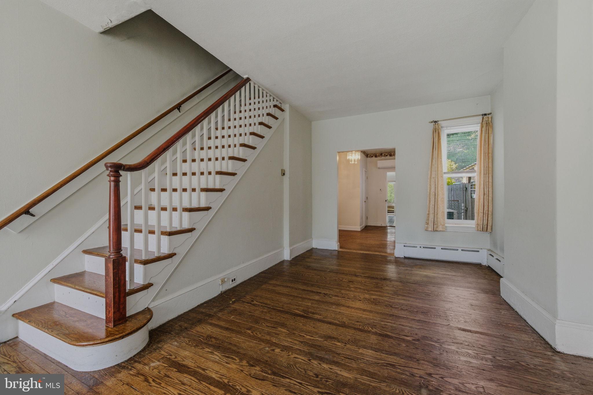 1905 North Scott Street Wilmington, DE 19806 - Photo 5 of 29 a view of an entryway with wooden floor and stairs