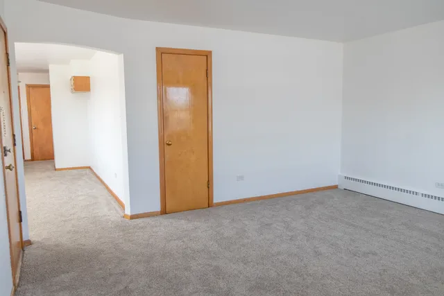 an empty room with closet area
