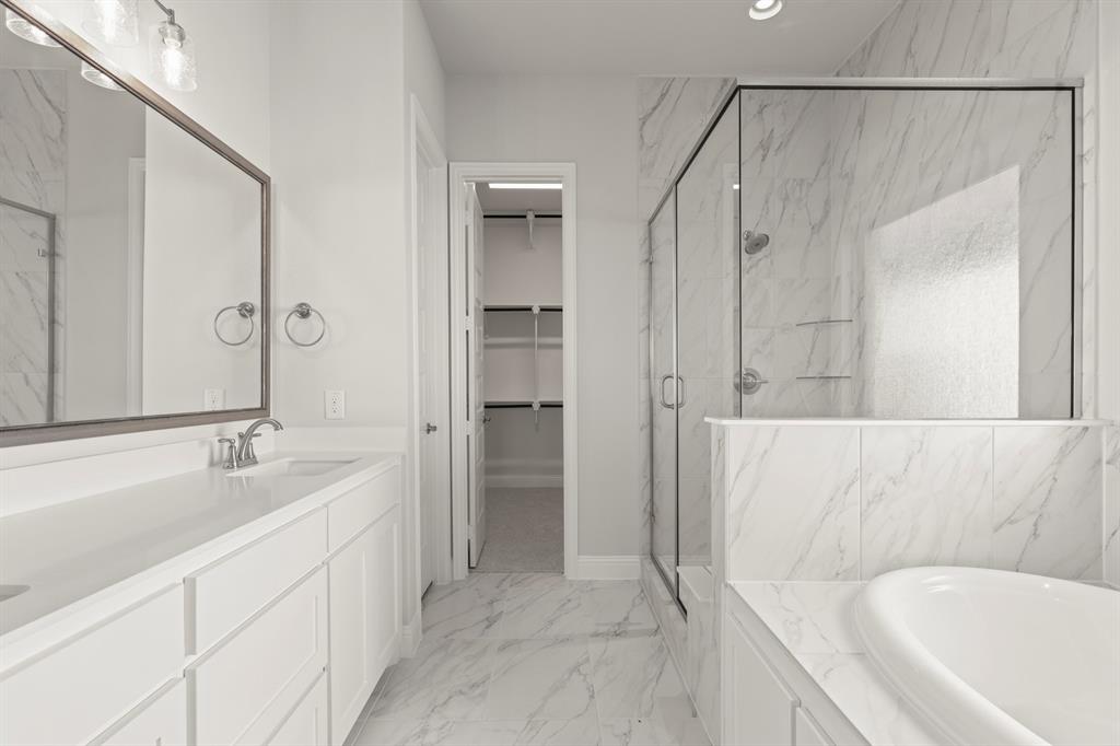 3802 Windmere Drive Rowlett, TX 75088 - Photo 16 of 34 a spacious bathroom with a tub shower and sink