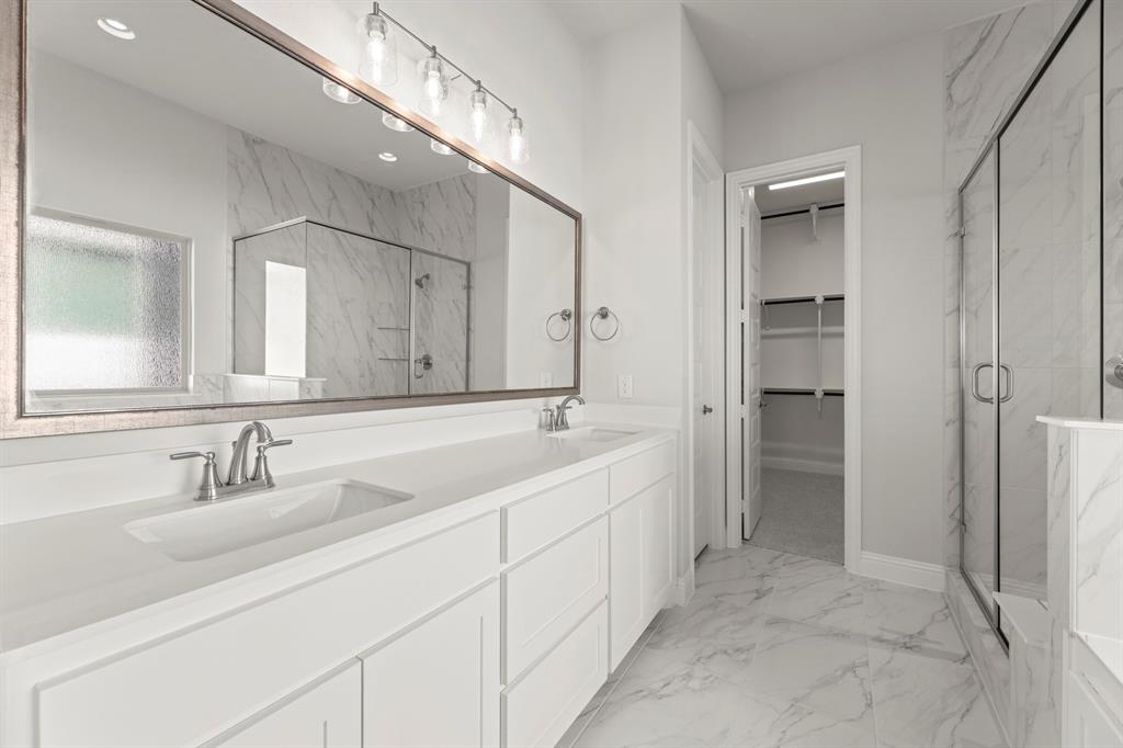 3802 Windmere Drive Rowlett, TX 75088 - Photo 17 of 34 a spacious bathroom with a double vanity sink mirror and double
