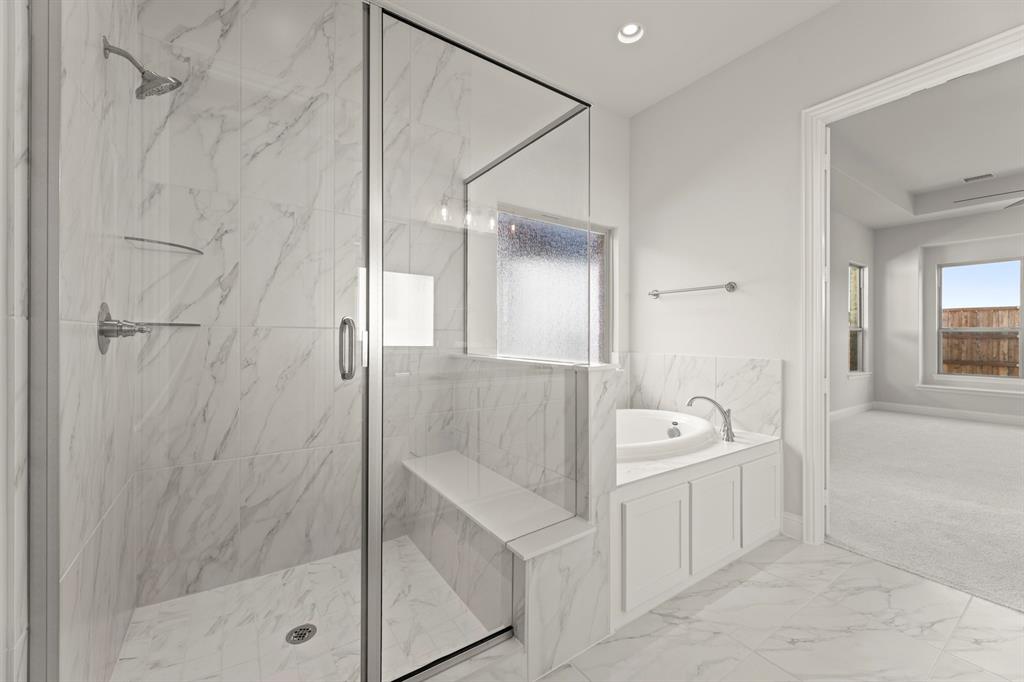 3802 Windmere Drive Rowlett, TX 75088 - Photo 18 of 34 a spacious bathroom with a bathtub shower and sink
