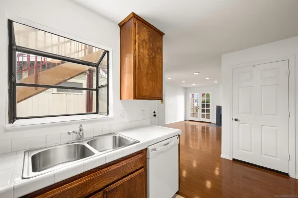 a kitchen with a sink and a refrigerator