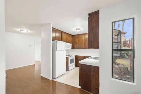 a kitchen with a refrigerator and a sink