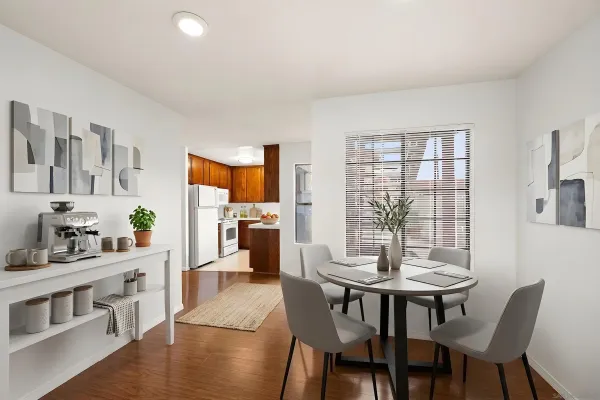 a view of a dining room with furniture and wooden floor