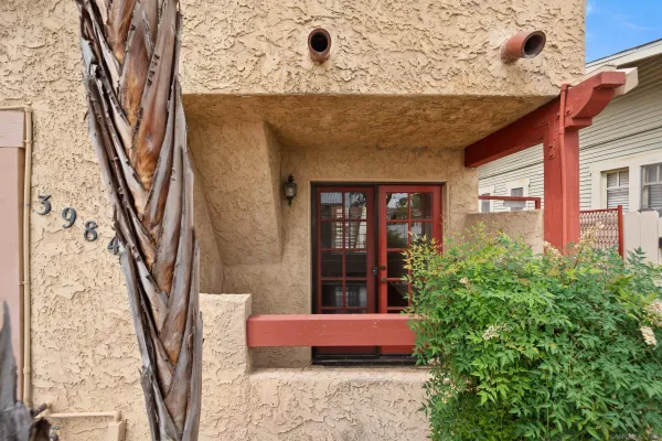 a front view of a house with outdoor seating