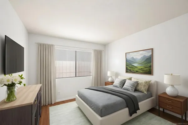 a bedroom with a bed and a flat screen tv