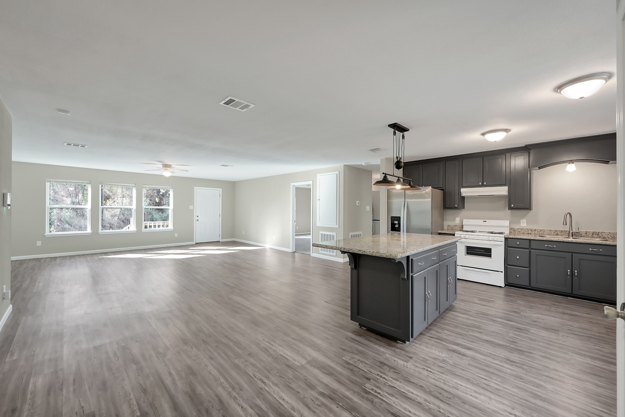 3527 Gary Lane Spring, TX 77380 - Photo 11 of 47 a large kitchen with granite countertop a large counter top and stainless steel appliances