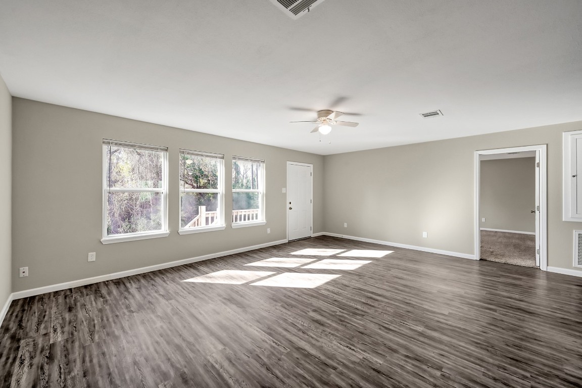 3527 Gary Lane Spring, TX 77380 - Photo 14 of 47 a view of an empty room with window and wooden floor