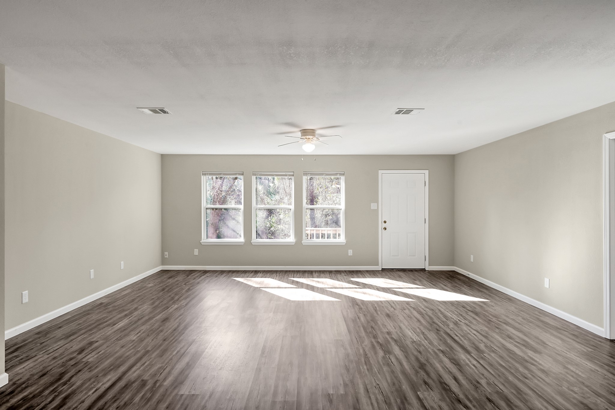 3527 Gary Lane Spring, TX 77380 - Photo 15 of 47 a view of an empty room with wooden floor and a window