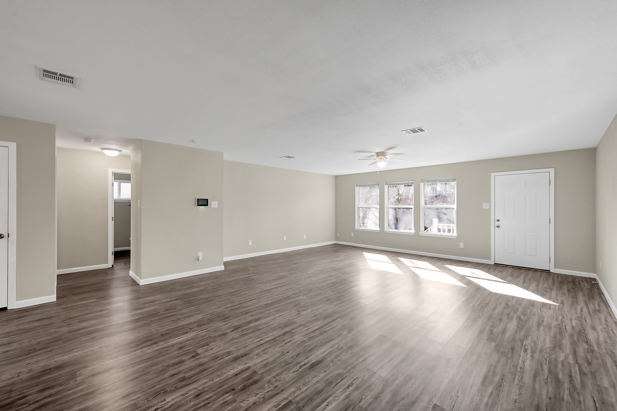 3527 Gary Lane Spring, TX 77380 - Photo 16 of 47 a view of an empty room with window and wooden floor