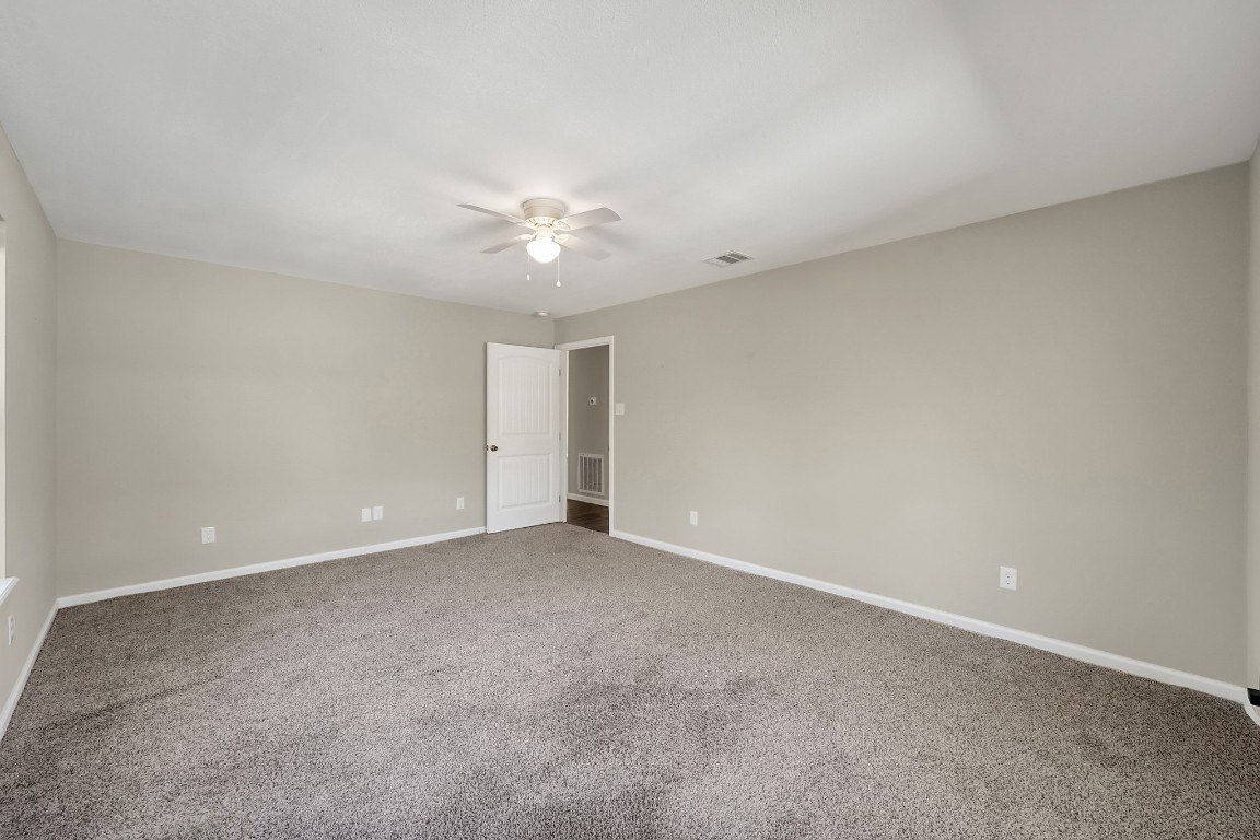3527 Gary Lane Spring, TX 77380 - Photo 19 of 47 an empty room with a ceiling fan and a window