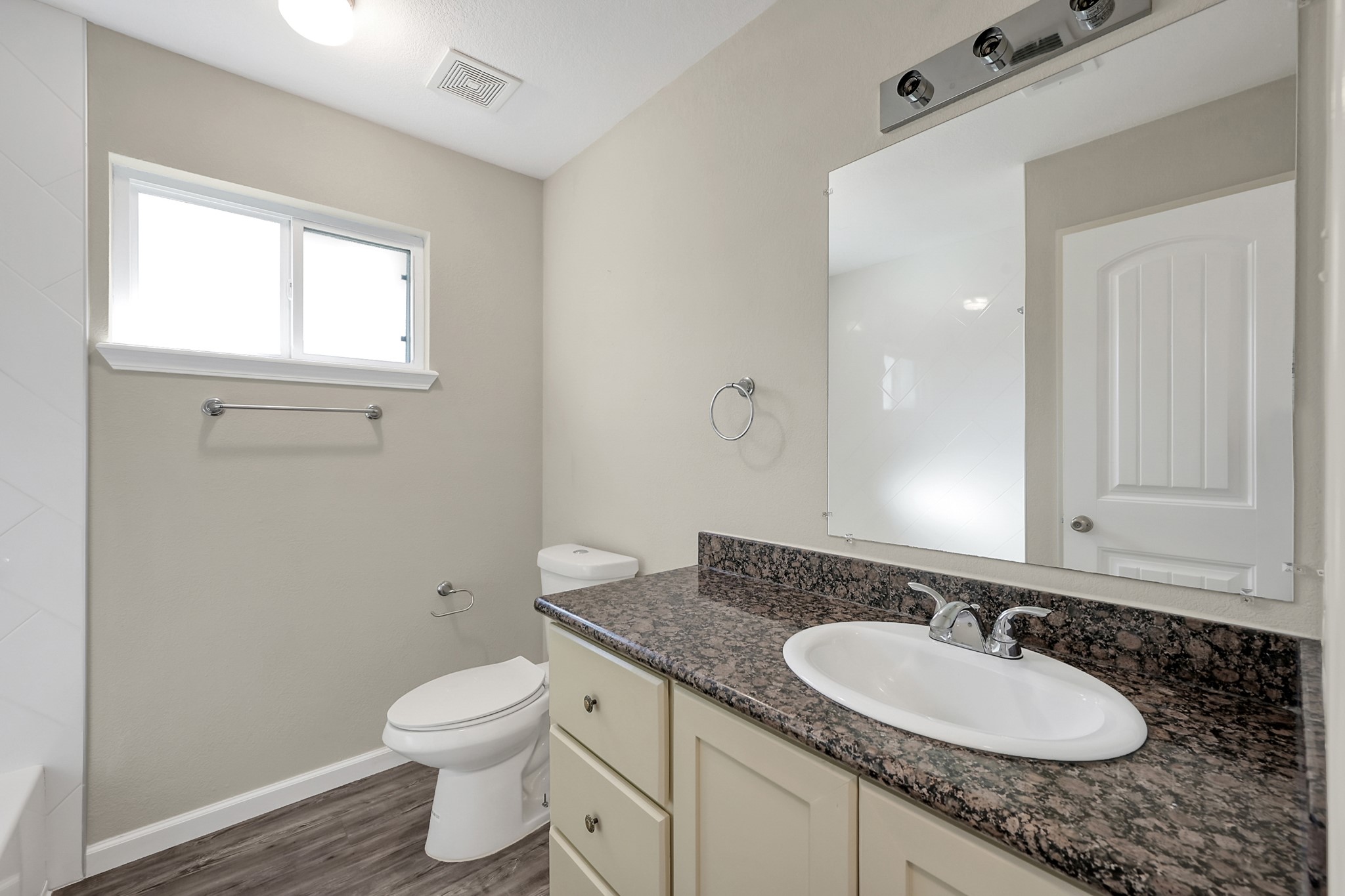 3527 Gary Lane Spring, TX 77380 - Photo 23 of 47 a bathroom with a granite countertop toilet a sink and a mirror