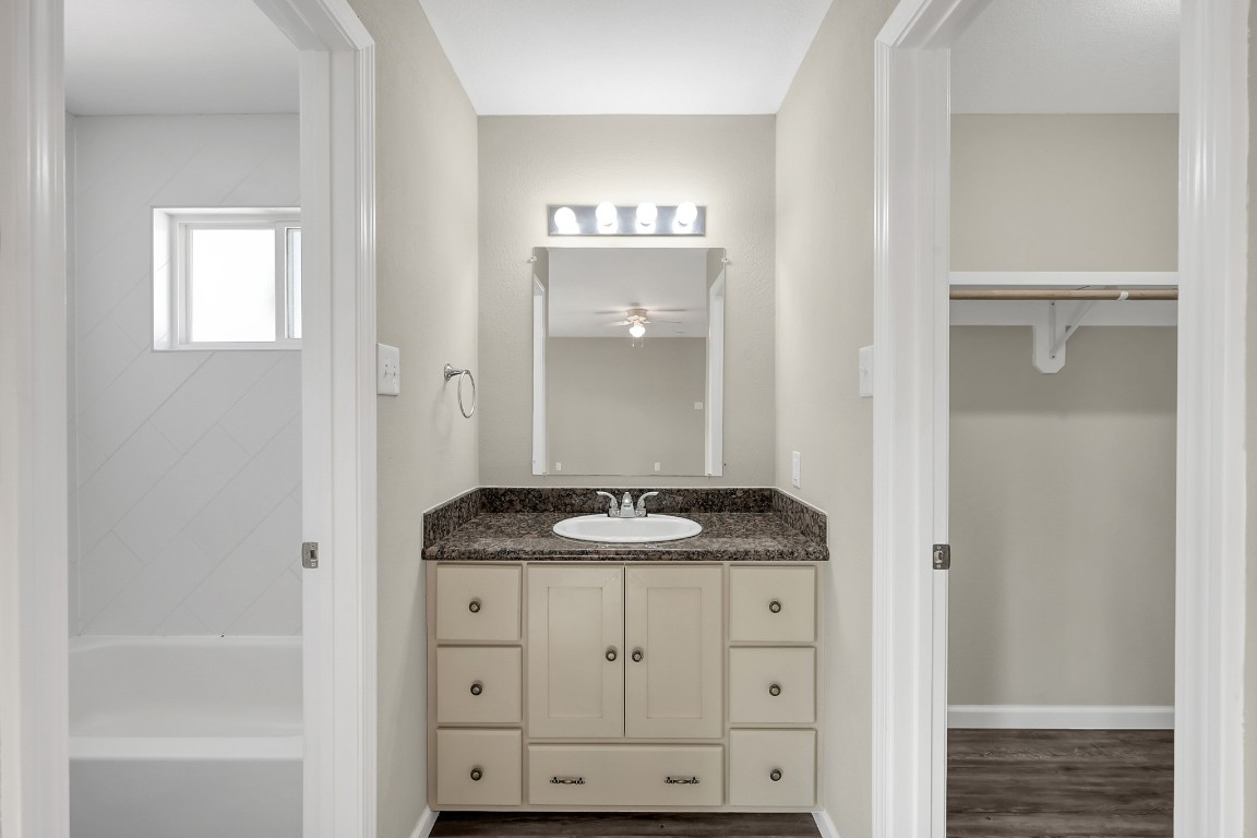 3527 Gary Lane Spring, TX 77380 - Photo 30 of 47 a bathroom with a granite countertop sink a mirror and a