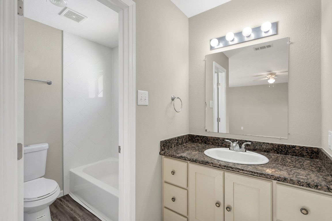 3527 Gary Lane Spring, TX 77380 - Photo 31 of 47 a bathroom with a granite countertop sink a toilet and a tub
