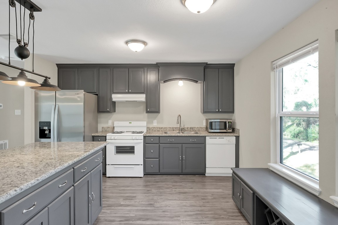 3527 Gary Lane Spring, TX 77380 - Photo 10 of 47 a kitchen with stainless steel appliances granite countertop a stove a sink and a refrigerator